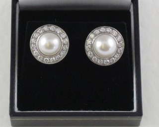 A pair of diamond and pearl earrings, approx 0.85ct