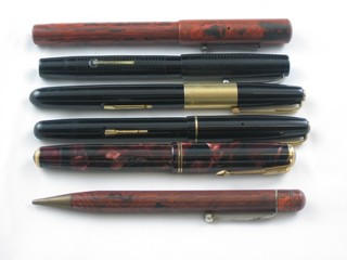 A Parker Fountain pen with brown marbled case, a black  Waterman 502 fountain pen, a black Waterman 877 fountain pen,  a Blackbird self filling fountain pen and a fountain pen and  propelling pencil contained in marble finished cases