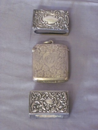 An Edwardian engraved silver vesta case, Birmingham 1901 together with 2 silver match slips