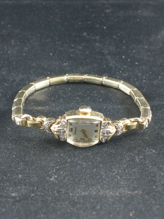 A lady's Earland wristwatch contained in a 14ct gold case with integral bracelet set diamonds
