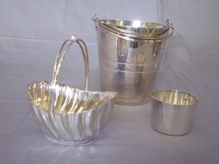 A circular silver plated ice pail, an oval Britannia metal dish and a circular dish