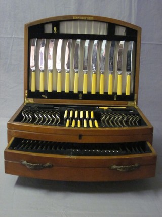 A canteen of silver plated Old English pattern flatware, contained in a walnut canteen box