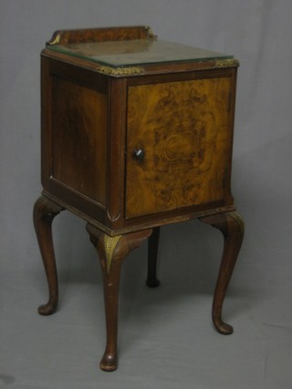 A Queen Anne style walnut pedestal pot cupboard enclosed by a panelled door, raised on cabriole supports 15"