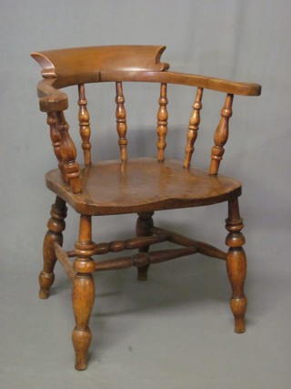 An elm captain's chair with turned decoration