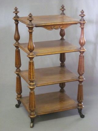A Victorian square walnut 4 tier what-not, raised on turned and fluted columns 14"