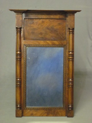 A 19th Century rectangular plate chimney mirror contained in a walnut frame 20"
