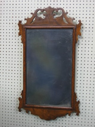 A Chippendale style rectangular plate mirror contained in a walnut frame 15"