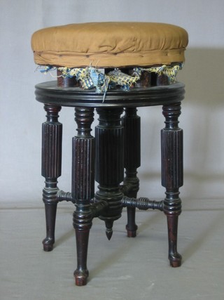 A William IV reeded mahogany piano stool, raised on cabriole supports
