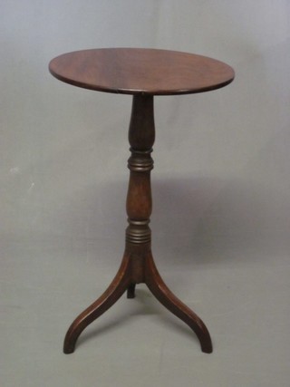 A 19th Century circular mahogany wine table, raised on a pillar and tripod base 15"