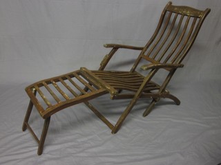 A pair of wooden slatted steamer chairs, the reverse with Cunard label