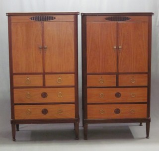 A matched pair of Continental D shaped cabinets enclosed by panelled doors, the base fitted 2 short drawers above 2 long drawers 33"