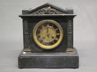 A Victorian French 8 day striking mantel clock with Roman numerals, contained in a black marble architectural case