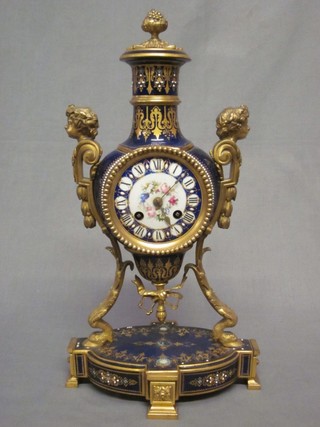 A 19th Century French 8 day striking mantel clock contained in a "Sevres" blue porcelain O shaped case, with gilt metal mounts to the base and with cypher mark, 16"