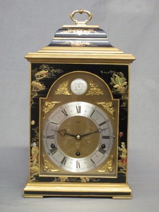 A Georgian style chiming bracket clock with arched gilt dial and silvered chapter ring, contained in a black chinoiserie lacquered case by Elliot and retailed by John Walker of London