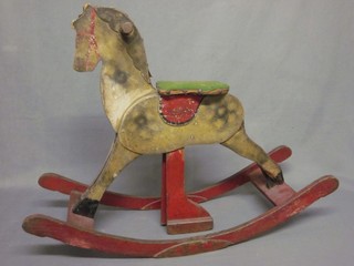 A childs wooden painted rocking horse 31"