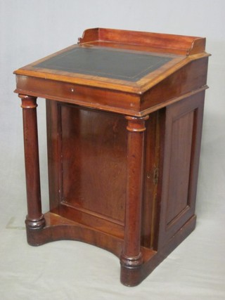 A Victorian mahogany Davenport desk with three-quarter gallery fitted a pen recess, the pedestal fitted 3 long drawers enclosed by a panelled door and raised on turned supports 23"