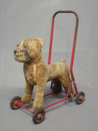 A childs push-a-long figure of a dog