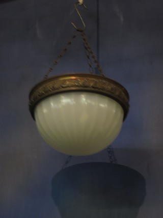 A circular vaseline glass bowl light shade contained in a metal mount 10"