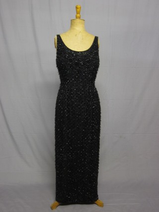 A lady's 1950's silk and jet beaded evening dress, size 12, previously bought at a Children in Need Sale some years ago,