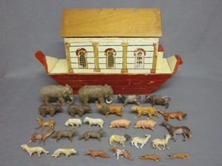 A wooden painted Noah's Ark and 27 various animals comprising 2 elephants, 2 deer, 2 goats, 2 wolves, 2 horses, 2 sheep, 2 pigs, 2 dogs, 2 bears, 2 lions, 2 cows, 2 hares, 2 foxes and a ram, some damaged,