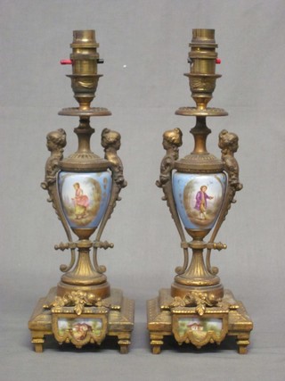 A pair of 19th Century gilt ormolu and porcelain candlesticks, converted for use as electric table lamps 14"
