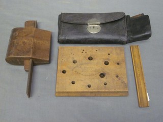 A wooden slide rule by Flemming & Co. Royal Exchange, a wooden drill gauge, a section of various carving implements etc