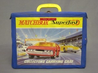 A collection of Match Box toy cars contained in a plastic carrying case