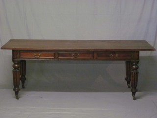 A 19th Century rectangular mahogany library table fitted 6 drawers, raised on turned and reeded supports 84"