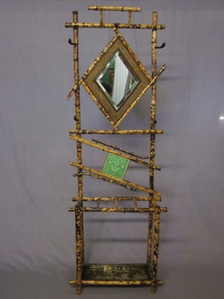 A bamboo hall stand with diamond shaped bevelled plate mirror complete with drip tray 36"