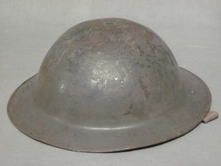 A British Steel helmet, some dents,