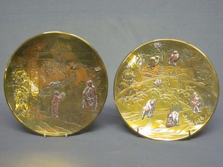 A pair of Japanese engraved copper and brass dishes, decorated garden scenes 9 1/2"