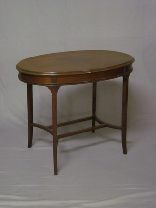 An Edwardian oval mahogany occasional table, raised on square tapered supports 36"