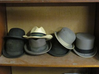A gentleman's grey top hat by Lincoln Bennett, a gentleman's grey bowler hat by Scotts, a bowler hat by Locks, a lightweight bowler hat, 2 Homburg hats by Locks and a straw hat, all in poor condition,