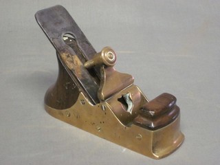A Victorian wooden and brass plane, signed brown