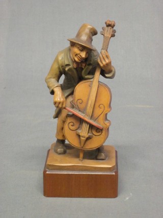 A figure of standing Cellist 7"