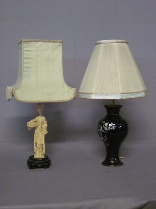 An Oriental black lacquered table lamp in the form of a vase with mother of pearl decoration 11" and an Oriental style figure in the form of a table lamp 11"