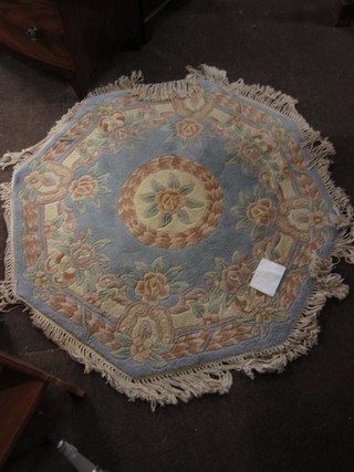 An octagonal blue ground and floral patterned Chinese rug 47"