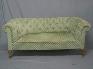 A Victorian mahogany framed Chesterfield upholstered in buttoned back green material 68"