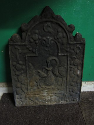 An arch shaped cast iron fire back decorated scenes from Aesop's fables 17"