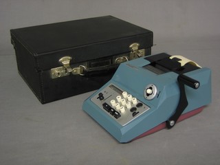 An Inland Revenue issue Olivetti calculator complete with carrying case