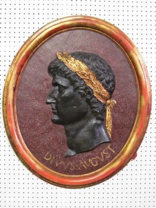 An oval plaque depicting Caesar marked Divvs.Avgvst 25"