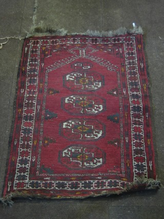 An Afghan prayer rug with mirhab and 4 octagons to the centre 39" x 37", some wear,