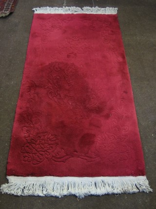 A red ground Chinese rug 61" x 30"