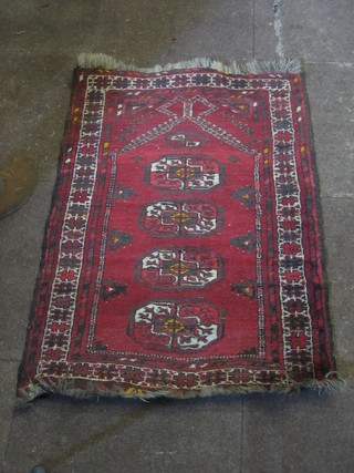A reg ground Afghan prayer rug with mirhab and 4 octagons to the centre 39" x 27"