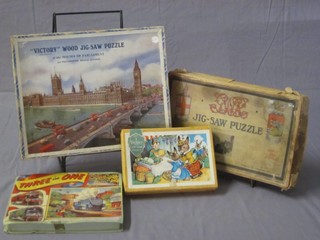 A Victory jigsaw puzzle - The Houses of Parliament, a GWR jigsaw puzzle of Oxford, a 3-in-1 jigsaw puzzle and 1 other small Victory puzzle