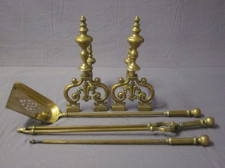 A pair of Victorian brass fire dogs and 3 piece brass fireside companion set with shovel, tongs and poker
