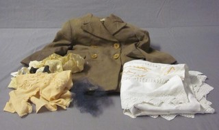 A childs The Hunter coat, an embroidered table cloth and various other fabric items