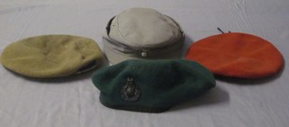 A post war German military peaked cap and 3 berets