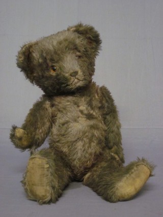 A brown teddybear with articulated body 20"