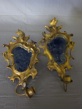 A pair of small gilt metal framed wall mirrors with candle holders